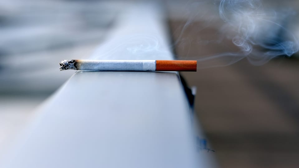 cigarette-on-railing